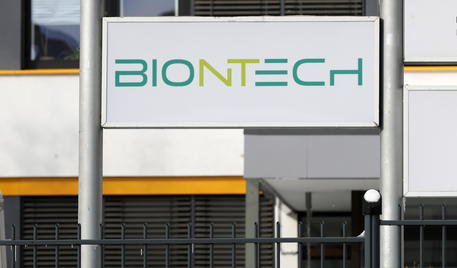 epa09001266 A view of a logo of BionTech at the entrance to an industrial park in which the biopharmaceutical company BionTech is located in Marburg, Germany, 10 February 2021. According to a press release issued on 10 February 2021, BioNTech started at the Marburg facility the production of mRNA, the active pharmaceutical ingredient of the Pfizer-BioNTech COVID-19 vaccine.  EPA/RONALD WITTEK