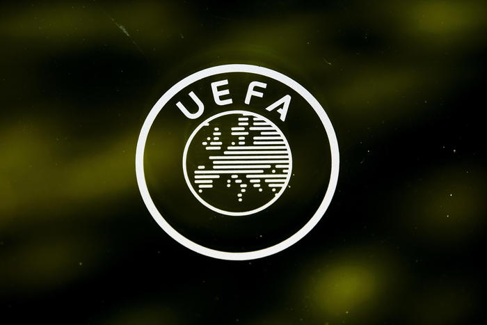 epa08389061 (FILE) - A UEFA logo is pictured through a window prior to the UEFA Europa League 2019/20 Round of 16 draw, at the UEFA Headquarters in Nyon, Switzerland, 28 February 2020 (re-issued on 28 April 2020). UEFA has given 25 May 2020 as a deadline date to European Leagues to decide wether to cancel or restart their seasons after the suspension amid COVID-19 coronavirus pandemic. UEFA's president Aleksander Ceferin explained that 'National Associations and/or Leagues should communicate to UEFA by 25 May 2020 the planned restart of their domestic competitions'. In case of cancelation 'UEFA would require the National Association to explain the special circumstances justifying such premature termination and to select clubs for the UEFA club competitions 2020/21 on the basis of sporting merit in the 2019/20 domestic competitions'.  EPA/JEAN-CHRISTOPHE BOTT *** Local Caption *** 55997733