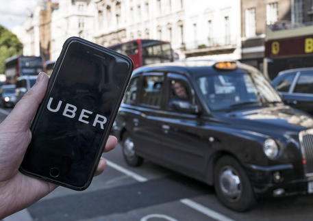 epa09023555  (FILE) - An image showing an Uber app on a mobile phone in central London, Britain, 22 September 2017 (re-issued 19 February 2021). The UK Supreme Court on 19 February 2021 ruled the Uber drivers are not not self-employed but workers. Uber, that has some 45,000 drivers working in London and that lost earlier court cases, said it would contact its active drivers across UK and discuss the operations. The ruling could mean Uber drivers may be entitled to holiday payments and minimum wages.  EPA/WILL OLIVER *** Local Caption *** 55660504
