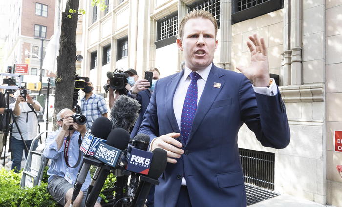 epa09166052 Andrew Giuliani, the son of Rudolph Giuliani, a former lawyer for President Donald Trump, speaks to reporters gathered outside his fatherÂ’s apartment building in New York, New York, USA, 28 April 2021. United States federal authorities raided Rudolph GiulianiÂ’s apartment and nearby office earlier today as part of an ongoing criminal investigation into GiulianiÂ’s dealings with Ukraine.  EPA/JUSTIN LANE