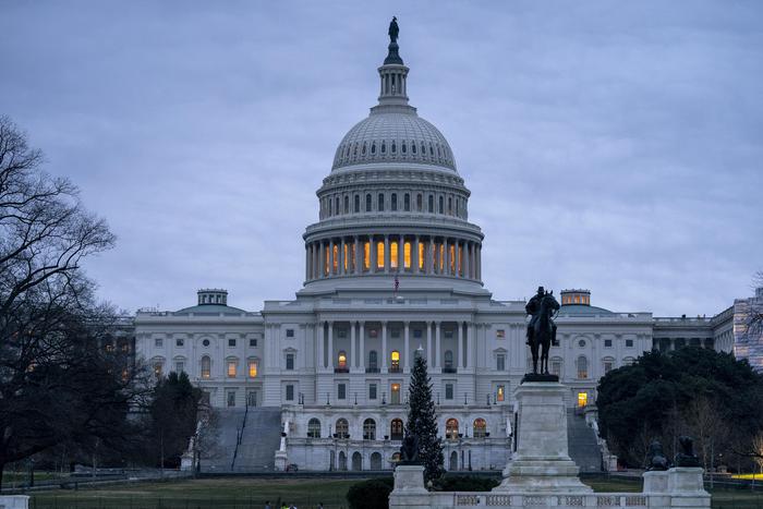 The Capitol is seen under early morning gray skies in Washington, Thursday, Dec. 20, 2018. The Senate approved legislation to temporarily fund the government late last night, a key step toward averting a federal shutdown after President Donald Trump backed off his demand for money for a border wall with Mexico.  The House is expected to vote before Friday's deadline, when funding for a portion of the government expires. Without resolution, more than 800,000 federal workers would face furloughs or be forced to work without pay, disrupting government operations days before Christmas. (ANSA/AP Photo/J. Scott Applewhite) [CopyrightNotice: Copyright 2018 The Associated Press. All rights reserved]