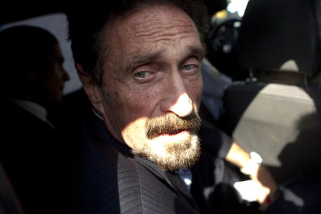 epa09297052 (FILE) - US millionaire John McAfee inside a vehicle of Guatemalan Migration towards airport in Guatemala City, Guatemala, 12 December 2012 (Reissued 23 June 2021). According to the Catalan justice department, John McAfee, 75, was found dead in his cell in a Barcelona prison. Earlier in the day the Audiencia Nacional (Spain's National Court) approved his extradition to the US where he was expected to face tax evasion charges.  EPA/Saul Martinez *** Local Caption *** 50632488