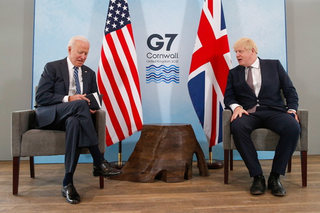 epa09260805 US President Joe Biden (L) looks at a notebook during his bilateral meeting with British Prime MinisterÂ Boris Johnson (R) in Carbis Bay, Britain, on 10 June 2021. British Prime MinisterÂ Boris JohnsonÂ is meetingÂ Joe BidenÂ for the first time ahead of the Group of Seven summit that the UK is hosting.  EPA/Hollie Adams / POOL