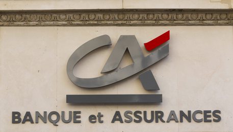 epa02916545 A general view of the logo outside a branch of French bank Credit Agricole, Paris, 14 September 2011. The fallout from the eurozone crisis deepened as Moody's credit ratings agency announced it was downgrading French banks Societe Generale and Credit Agricole over their exposure to Greek debt. Moody's downgraded the long-term debt and deposit ratings of Credit Agricole from Aa1 to Aa2 and Societe Generale's from Aa2 to Aa3, against the backdrop of renewed fears that Greece is headed for a debt default.
The agency left the rating of the country's biggest bank, BNP Paribas, unchanged for now.  EPA/IAN LANGSDON