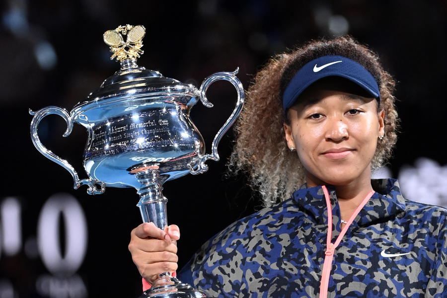 epa09025522 Naomi Osaka of Japan holds the trophy after winning the women's singles final against Jennifer Brady of the United States on day 13 of the Australian Open tennis tournament at Rod Laver Arena in Melbourne, Australia, 20 February 2021.  EPA/DAVE HUNT  AUSTRALIA AND NEW ZEALAND OUT