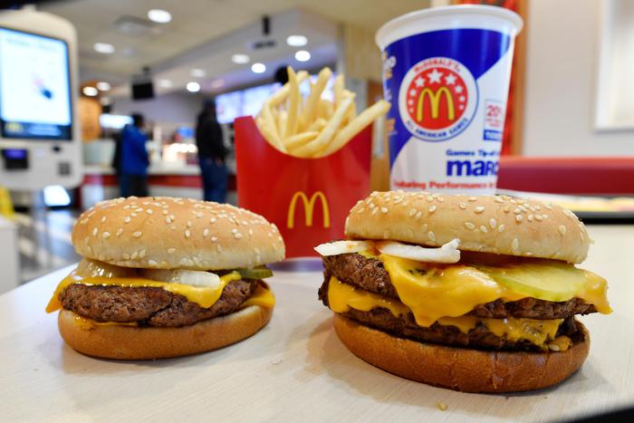 FILE- In this March 6, 2018, file photo, a McDonald's Quarter Pounder, left, and Double Quarter Pound burger is shown with fresh beef in Atlanta. McDonald's Corp. reports earnings Monday, April 30. (ANSA/AP Photo/Mike Stewart, File) [CopyrightNotice: Copyright 2018 The Associated Press. All rights reserved.]
