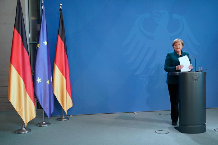 epa08313922 German Chancellor Angela Merkel speaks during a press statement at the chancellery in Berlin, Germany, 22 March 2020. German Chancellor Angela Merkel informed after a telephone conference that took place with the Heads of German Regional States on the spread of the coronavirus SARS-CoV-2 which causes the COVID-19 disease. Media reports state, that  the assembly of more than two persons if not family or household members are generally prohibited throughout Germany.  EPA/CLEMENS BILAN / POOL