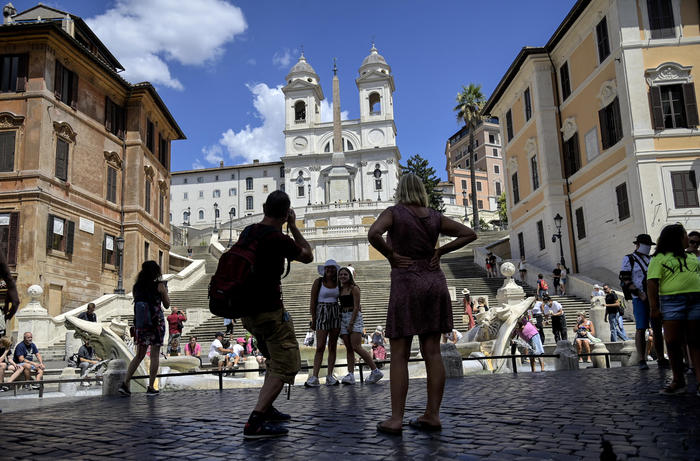 Few tourists visit Piazza di Spagna in Rome's city centre, Rome, Italy, 6 August 2020. The Italian tourism industry is experiencing an unprecedented crisis, as evidenced by the figure for the employed, which fell to 20% of the sector's normal workforce. ANSA/RICCARDO ANTIMIANI