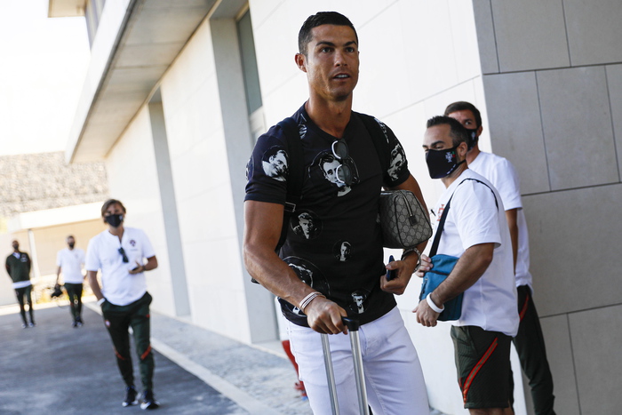 epa08637911 A handout photo made available by the Portuguese Football Federation (FPF) shows Portuguese national soccer player Cristiano Ronaldo arriving for the team's training session at Cidade do Futebol in Oeiras, Portugal, 31 August 2020. Portugal will face Croatia on 05 September 2020 in a UEFA Nations League match.  EPA/DIOGO PINTO/FPF/HO  HANDOUT EDITORIAL USE ONLY/NO SALES