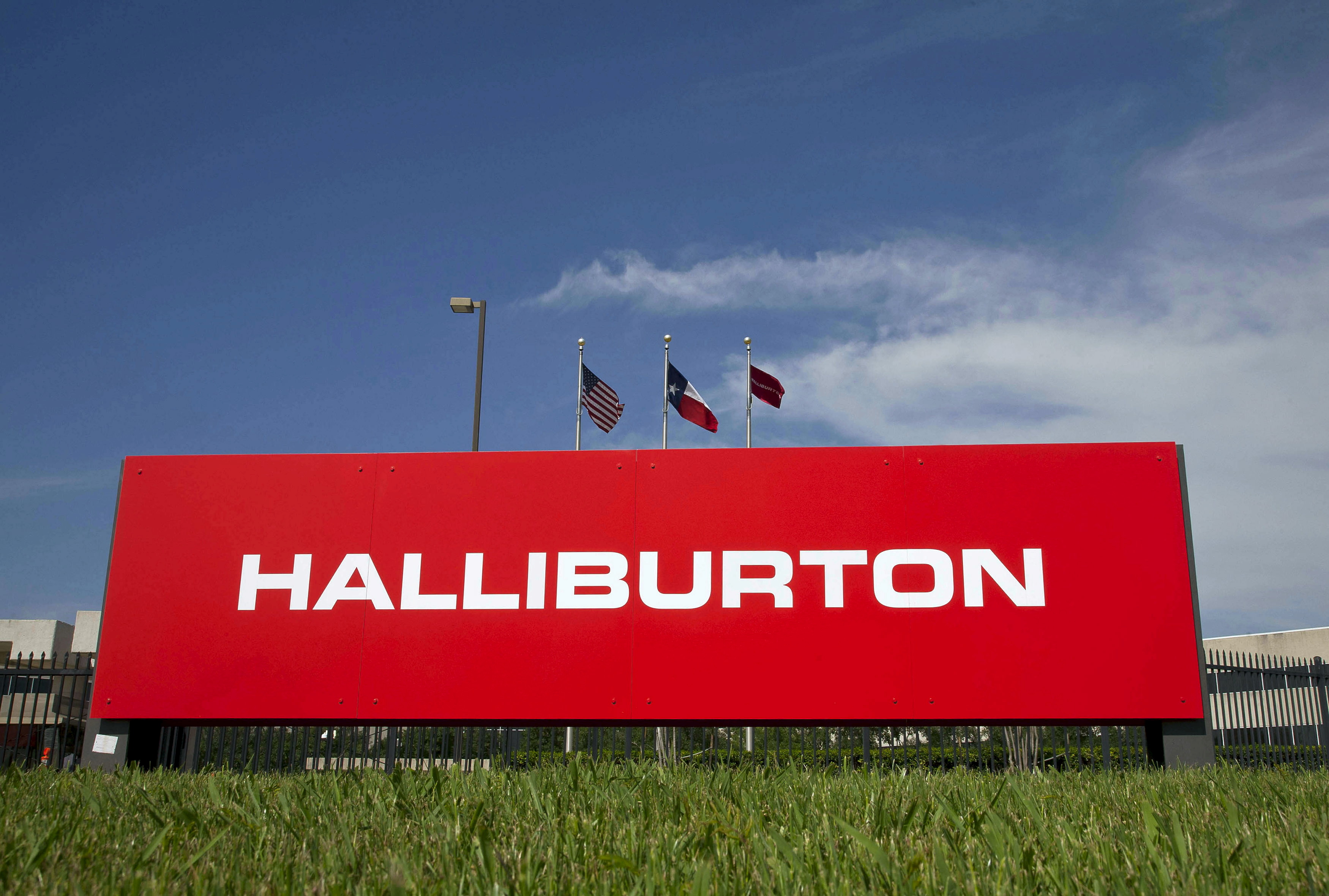 FILE PHOTO: The company logo of Halliburton oilfield services corporate offices is seen in Houston, Texas April 6, 2012. REUTERS/Richard Carson/File Photo
