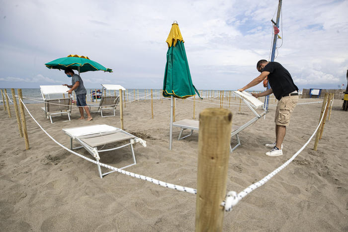 Umbrellas arranged in compliance with the rules on social distancing in a beach club in, in Fregene, a seaside resort located on the Tyrrhenian coast, about 30 kilometers from Rome, among the most renowned on the Lazio coast, during a gradual easing of lockdown restrictions introduced in response to the coronavirus disease (COVID-19) pandemic Rome, Italy, 29 May 2020. Italy is preparing for the summer season with beaches reopening under strict rules. ANSA/MASSIMO PERCOSSI