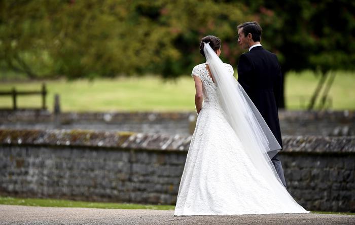 Pippa Middleton, second right and James Matthews walk, after their wedding ceremony, at St Mark's Church in Englefield, England Saturday, May 20, 2017. Middleton, the sister of Kate, Duchess of Cambridge married hedge fund manager James Matthews in a ceremony Saturday where her niece and nephew Prince George and Princess Charlotte was in the wedding party, along with sister Kate and princes Harry and William. (Justin Tallis/Pool Photo via AP) [CopyrightNotice: AFP or Licensors]