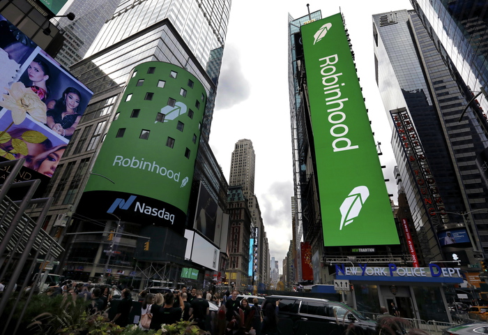 epa09377172 The logo of Robinhood Financial LLC, is seen on the Nasdaq stock exchange for the company's initial public offering in New York, New York, USA, 29 July 2021.  Robinhood, a financial services company that allows its users to trade stocks, ETFs, and cryptocurrency, priced its shares at 38 dollars per share in its initial public offering (IPO), putting the value of the company at 32 billion dollars.  EPA/PETER FOLEY
