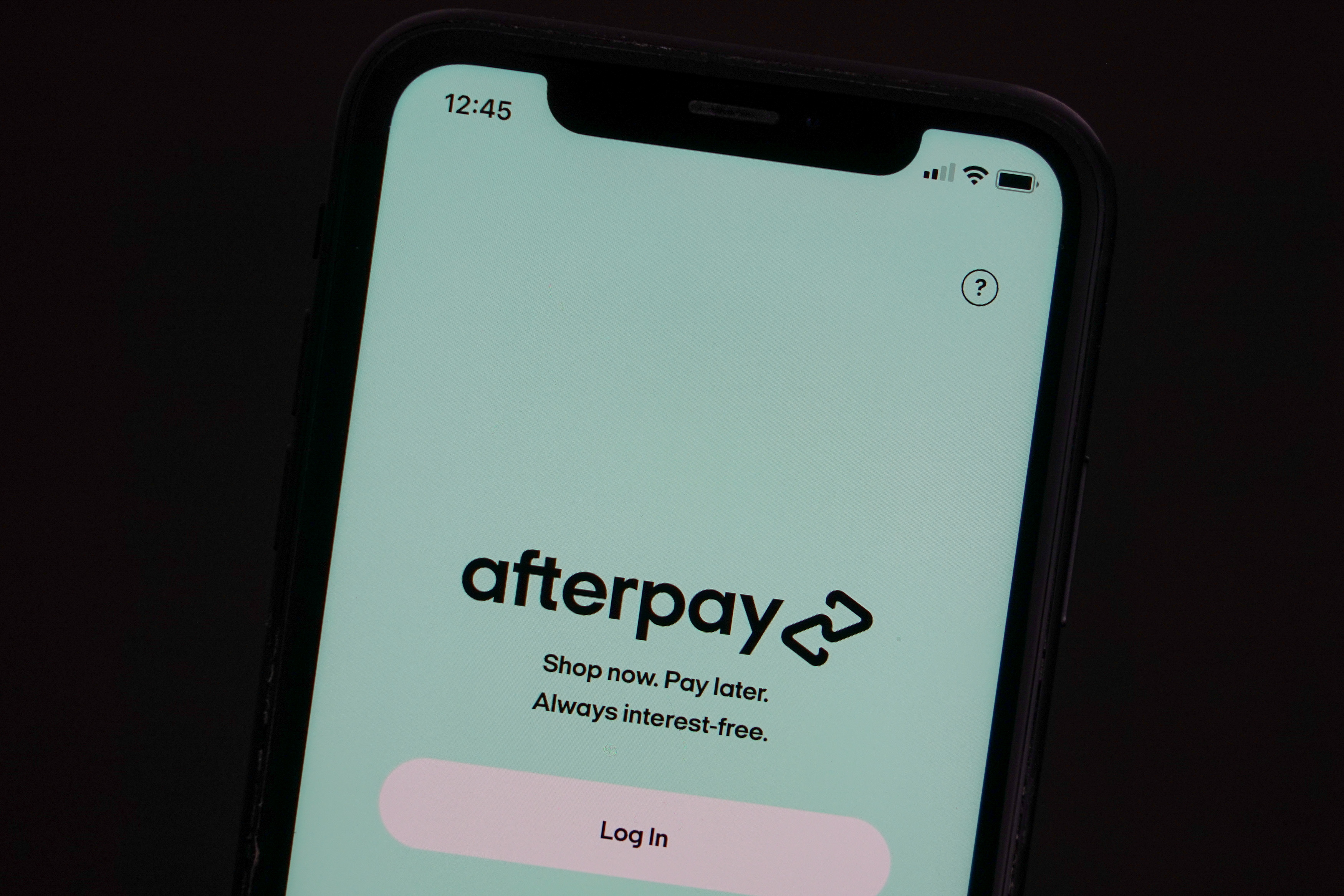 The Afterpay app is seen on the screen of a mobile phone in a picture illustration taken August 2, 2021.  REUTERS/Loren Elliott/Illustration