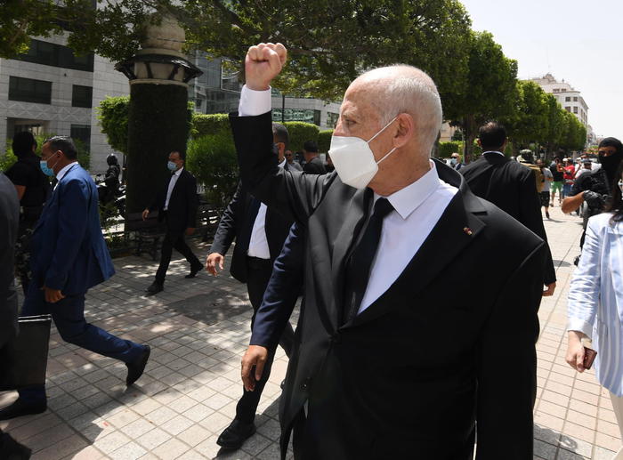 epa09386129 A handout photo made available by the Tunisian Presidency shows Tunisian President Kais Saied gesturing among supports as he walks protected by security guards in Habib Bourguiba Avenue, Tunis, Tunisia, 01 August 2021. Two Members of the Parliament were reportedly arrested on 01 August brining to three the number of MPs detained since Saied sacked prime minister Mechichi and suspended the parliament on 25 July. Saied said he acted within the constitution as US Secretary of State Antony Blinken called for the return 'to the democratic path' in the country.  EPA/PRESIDENCY OF TUNISIA HANDOUT  HANDOUT EDITORIAL USE ONLY/NO SALES