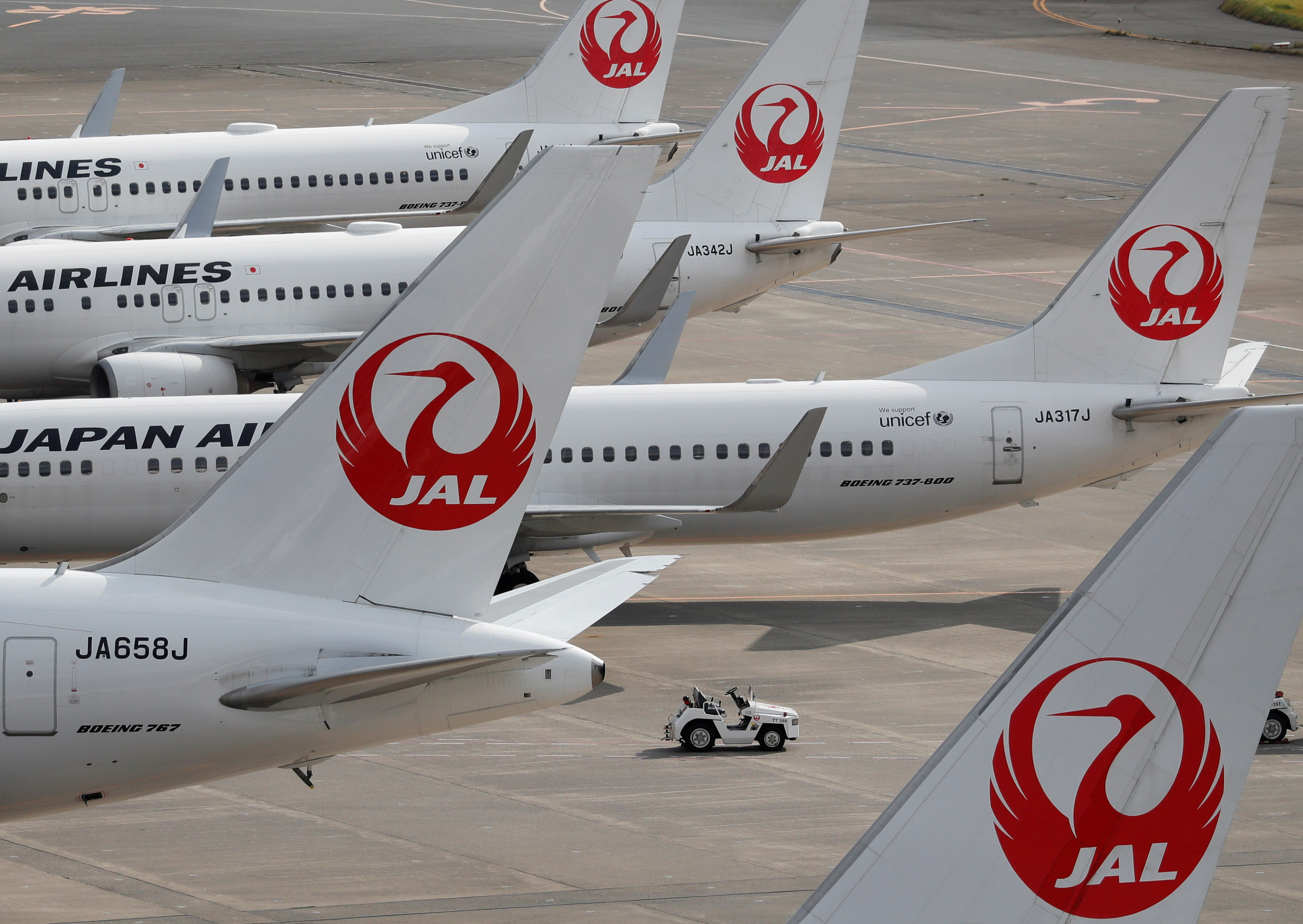 FILE PHOTO: Japan Airlines' (JAL) airplanes are seen, amid the coronavirus disease (COVID-19) outbreak, at the Tokyo International Airport, commonly known as Haneda Airport in Tokyo, Japan October 30, 2020. REUTERS/Issei Kato