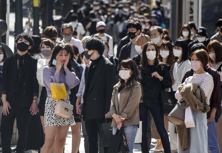 epa09142966 People wearing protective masks wait for a traffic signal on a crosswalk at Shibuya In Tokyo, Japan, 18 April 2021.  Tokyo marked 543 new COVID-19 Coronavirus infections on 18 April, over 500 cases for the sixth straight day while Osaka confirmed another record high 1,220 new infections, topping 1,000 cases for the sixth straight day. A senior ruling Liberal Democratic Party official said on 15 April that cancellation of  the Tokyo 2020 Olympic Games was an option if there is the surge in COVID19 infections. Japan's health experts have told that the COVID-19 pandemic has entered to the fourth wave.  EPA/KIMIMASA MAYAMA