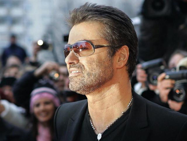 epa05688228 (FILE) - A file picture dated 16 February 2005 shows British pop singer George Michael smiling as he arrives for the presentation of the film 'George Michael: A Different Story', a documentary about his life, at the Berlinale Filmfestival in Berlin, Germany. According to reports on late 25 December 2016, British popstar George Michael has died peacefully at home at the age of 53, his publicist has announced.  EPA/PEER GRIMM