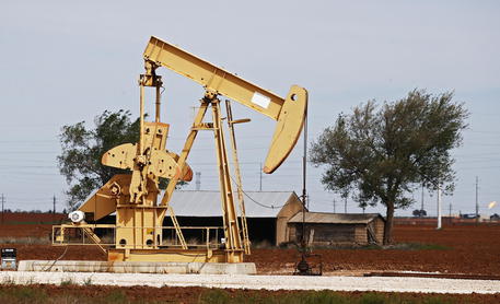 epa08348884 Pump jacks operate in the oil fields near Midland, Texas, USA, 07 April 2020. Midland, Texas is a city in western Texas, part of the Permian Basin area. Low oil prices in part due to the COVID-19 coronavirus crisis are causing the gas prices to drop dramatically across the country.  EPA/LARRY W. SMITH