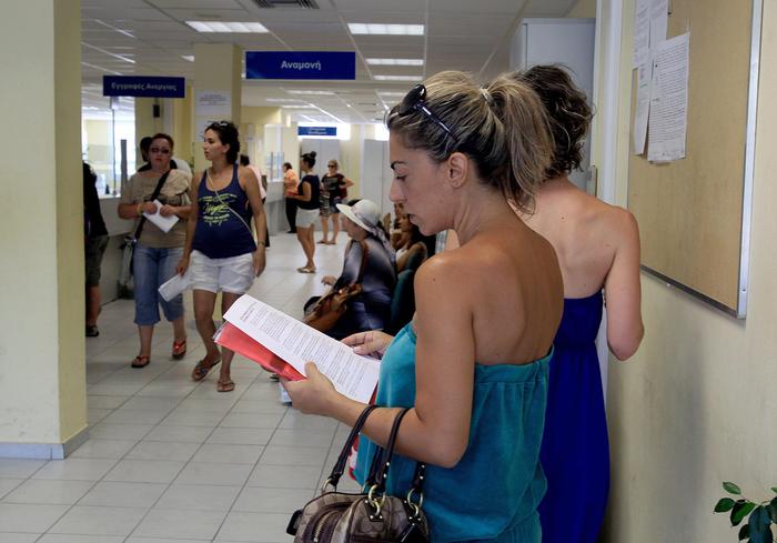 epa03817848 People wait in an unemployment office in Athens, Greece, 09 August 2013.  Unemployment in Greece reached a record 27.6 per cent in May, the statistics office said 08 August 2013.   Almost two-thirds of young people, 64.9 per cent, were without a job. The new figure was higher that the 27 per cent rate recorded in April and the 23.8 per cent in May last year. The employment outlook remained bleak as the Greek economy was expected to contract by at least 4.5 per cent this year, the central bank said. Highly indebted Greece has been implementing unpopular austerity measures demanded by the European Union and International Monetary Fund in exchange for a multibillion-euro bailout. It is in its sixth year of recession.  EPA/SIMELA PANTZARTZI