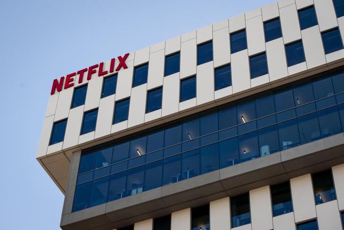 epa07932002 A Netflix logo hangs on the company's headquarters in Los Angeles, California, USA, 18 October 2019. On 17 October 2019 Netflix reported earnings of 1.47 US dollar per share, compared to analysts estimates of 1.05 US dollar per share.  EPA/CHRISTIAN MONTERROSA