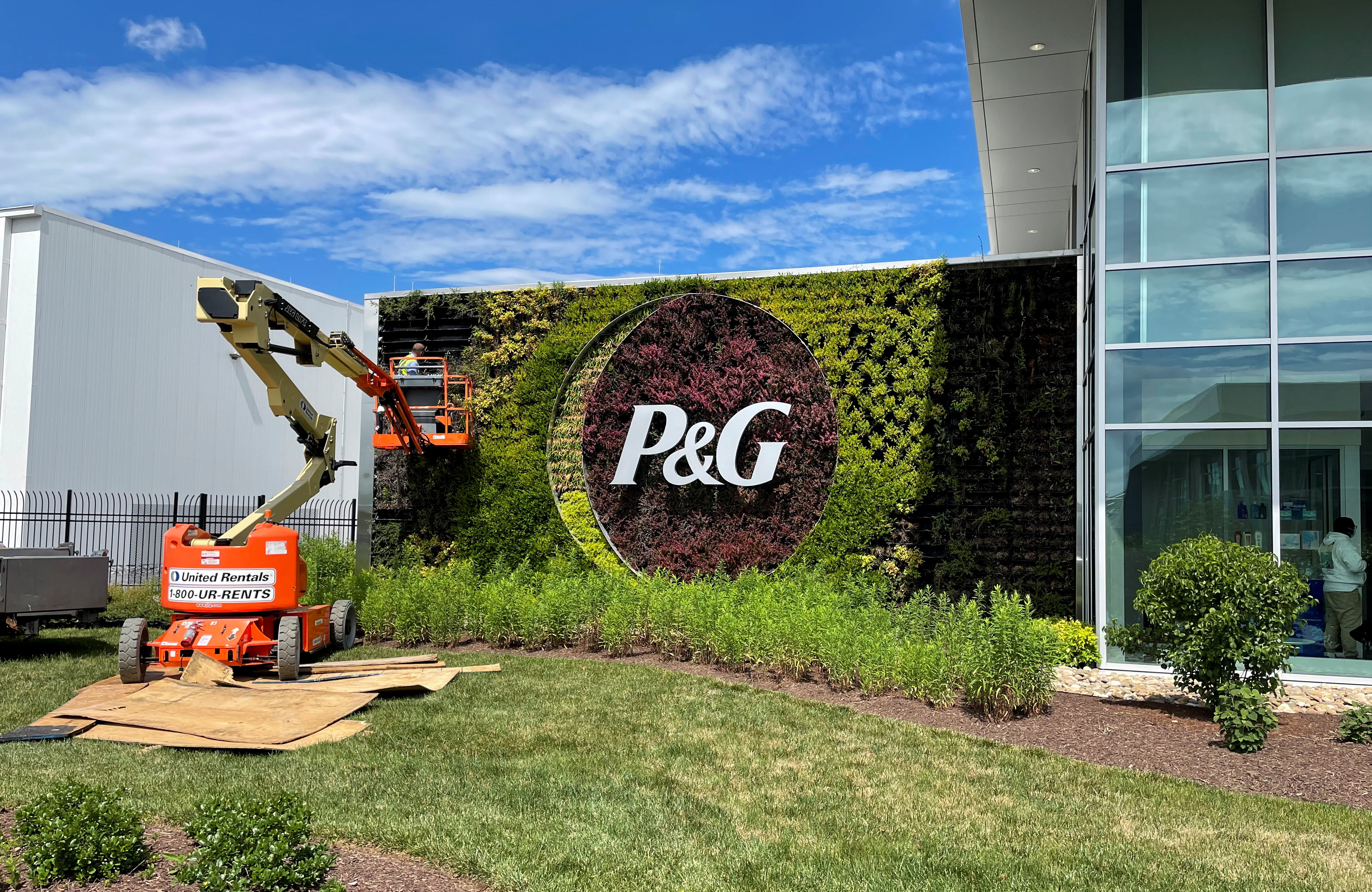A plant wall with Procter & Gamble's logo is pictured at the entrance to the company's highly automated cleaning products factory in Tabler Station, West Virginia, U.S., May 28, 2021. Picture taken May 28, 2021. REUTERS/Timothy Aeppel