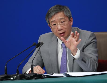 epa07426322 Yi Gang, Governor of the People's Bank of China (PBOC) speaks during a press conference on the sideline of the second session of the 13th National People's Congress (NPC) in Beijing, China, 10 March 2019.  EPA/HOW HWEE YOUNG
