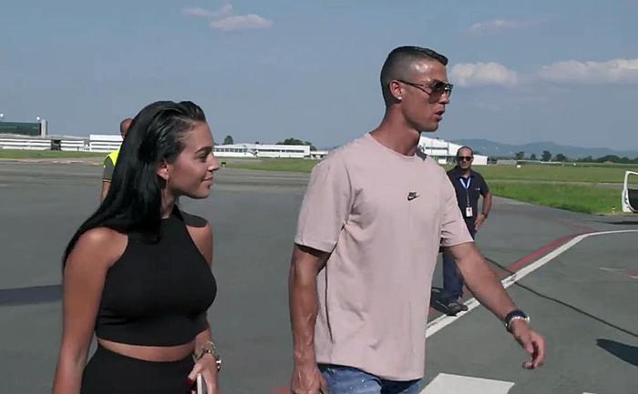 New Juventus soccer player Cristiano Ronaldo (R) of Portugal accompained by his girlfriend Georgina Rodriguez (L)  arrives at Caselle airport in Turin, Italy, 15 July 2018.
 ANSA/ ALESSANDRO DI MARCO