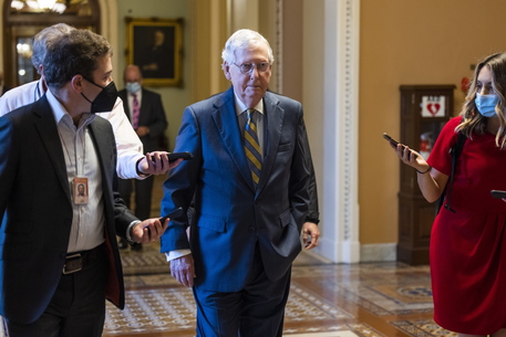 epa09509204 Republican Senate Minority Leader Mitch McConnell walks to his office ahead of a procedural vote to raise the debt limit in Washington, DC, USA, 06 October 2021. The vote will likely fail as Senate Republicans are expected to filibuster.  EPA/JIM LO SCALZO