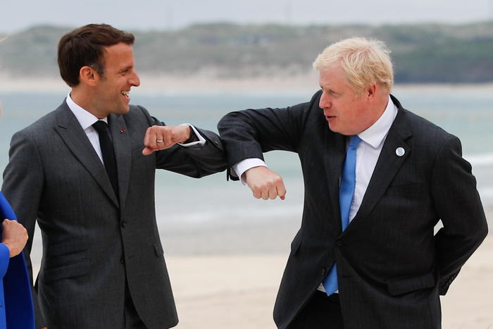 epa09262320 Britain's Prime Minister Boris Johnson (R) greets France's President Emmanuel Macron, during the G7 summit in Carbis Bay, Cornwall, Britain, 11 June 2021.  EPA/PHIL NOBLE / POOL