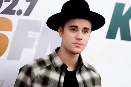 FILE - In this May 9, 2015 file photo, Justin Bieber arrives at Wango Tango 2015 in Carson, Calif. Bieber will make a special appearance at the inaugural Billboard Hot 100 Music Festival in August, along with headliners The Weeknd, Skrillex, Nicki Minaj and Lil Wayne. The festival will be held at New Yorks Nikon at Jones Beach Theater on Aug. 22 and 23 and will feature more than 40 hit making artists and breakout musicians over three stages.  (Photo by Richard Shotwell/Invision/ANSA/AP, File)