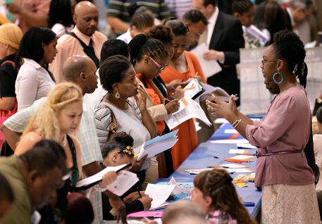 epa03941222 (FILE) A file photo dated 15 August 2012 showing people talking with prospective employers during a job fair at a community center in New York, New York, USA. Reports on 08 November 2013 state the United States Labor Department reporting the US economy added an unexpected 204,000 jobs in October 2013, twice the amount that analysts had predicted, despite the US government shutdown.  EPA/JUSTIN LANE