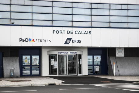 epa09603460 A picture shows the entrance of the main port of Calais, in Calais, France, 25 November 2021., France, 25 November 2021. At least 27 migrants have died and 2 others have been taken to hospital after a boat in which they were trying to cross the La Manche canal (English Channel) to Great Britain sank.  EPA/Mohammed Badra