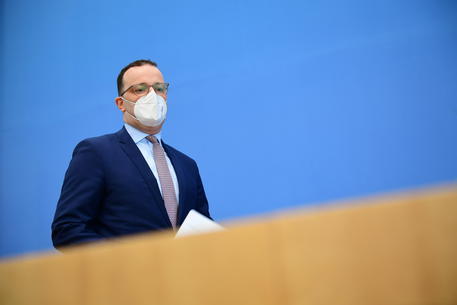 epa09136260 German Health Minister Jens Spahn arrives with a face mask for a press conference to speak to the media during the third wave of the coronavirus pandemic, in Berlin, Germany, 15 April 2021. German Health Minister Jens Spahn and Head of the Robert Koch Institute Lothar Wieler provided information during the weekly press conference on developments during the third coronavirus wave.  EPA/CLEMENS BILAN / POOL