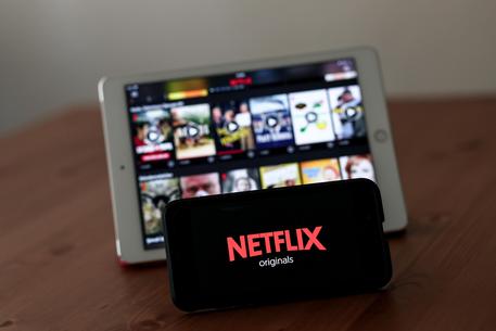 epa07753661 A Netflix page and logo displayed on a tablet and smart phone in Istanbul, Turkey, 02 August 2019. According to media reports, a Turkish regulation gave authority to the Turkish Radio and Television Supreme Council (RTUK) to regulate and monitor sound and visual broadcasting, including online streaming services like Netflix, other contents shared on social media platforms, and online news outlets on a regular basis.  EPA/SEDAT SUNA