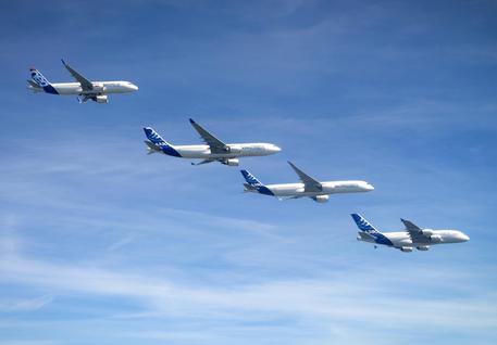 epa05711062 A handout photo dated 11 August 2016, made available by Airbus, showing Airbus planes from L-R A320, A330, A350-500 and A380 flying in formation at an undisclosed location. Airbus on 11 January 2017 in their press release said their commercial aircraft deliveries in 2016 increased for the 14th year in a row, reaching a new record for Airbus of 688 aircraft delivered to 82 customers. Airbus said their deliveries were more than 8 per cent higher than the previous record of 635 set in 2015. The planes delivered included 545 single aisle A320 Family of which 68 were A320neo, 66 A330s, 49 A350 XWBs and 28 A380s. Over 40 per cent of single aisle deliveries were the larger A321 models.  EPA/AIRBUS / H. GOUSSE / HANDOUT  HANDOUT EDITORIAL USE ONLY/NO SALES
