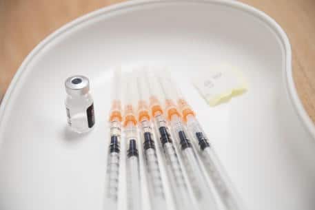 epa08961958 Syringes are filled with Pfizer-BioNTech vaccine against the coronavirus disease (COVID-19), at the Szent Imre University Teaching Hospital in Budapest, Hungary, 24 January 2021.  EPA/MARTON MONUS HUNGARY OUT
