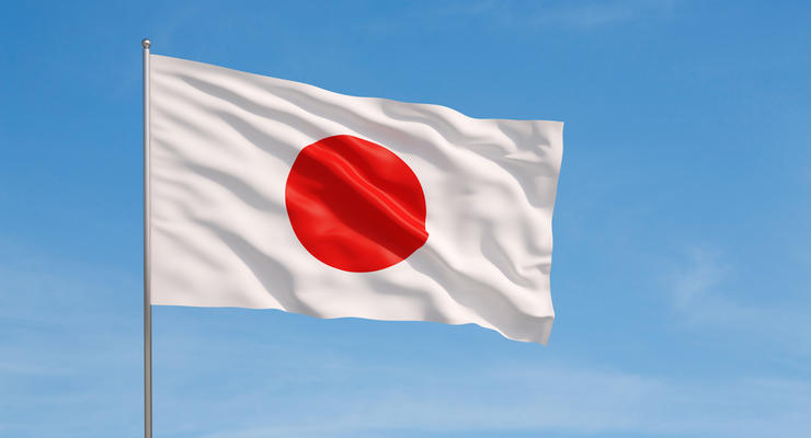 Waving flag of Japan on a sky background