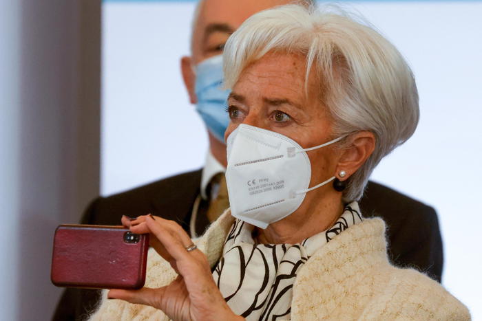 epa08931578 President of the European Central Bank (ECB) Christine Lagarde holds her smartphone as she attends the One Planet Summit, part of World Nature Day, at the Reception Room of the Elysee Palace, in Paris, France, 11 January 2021. The One Planet Summit, a large ly virtual event hosted by France in partnership with the United Nations and the World Bank, will include French President, German Chancellor and European Union chief.  EPA/LUDOVIC MARIN / POOL  MAXPPP OUT