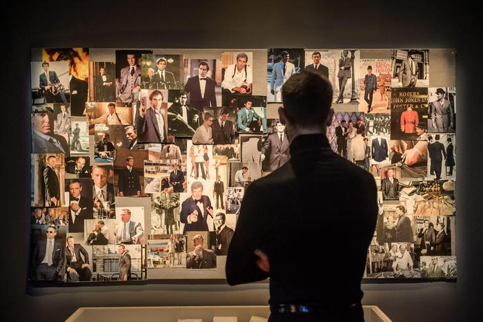 epa05256653 A visitor look at a wall filled with photographs during the press visit of the James Bond 007 retrospective exhibition at the Grande Halle de la Villette center in Paris, France, 13 April 2016. The exhibition runs from 16 April to 04 September 2016.  EPA/CHRISTOPHE PETIT TESSON