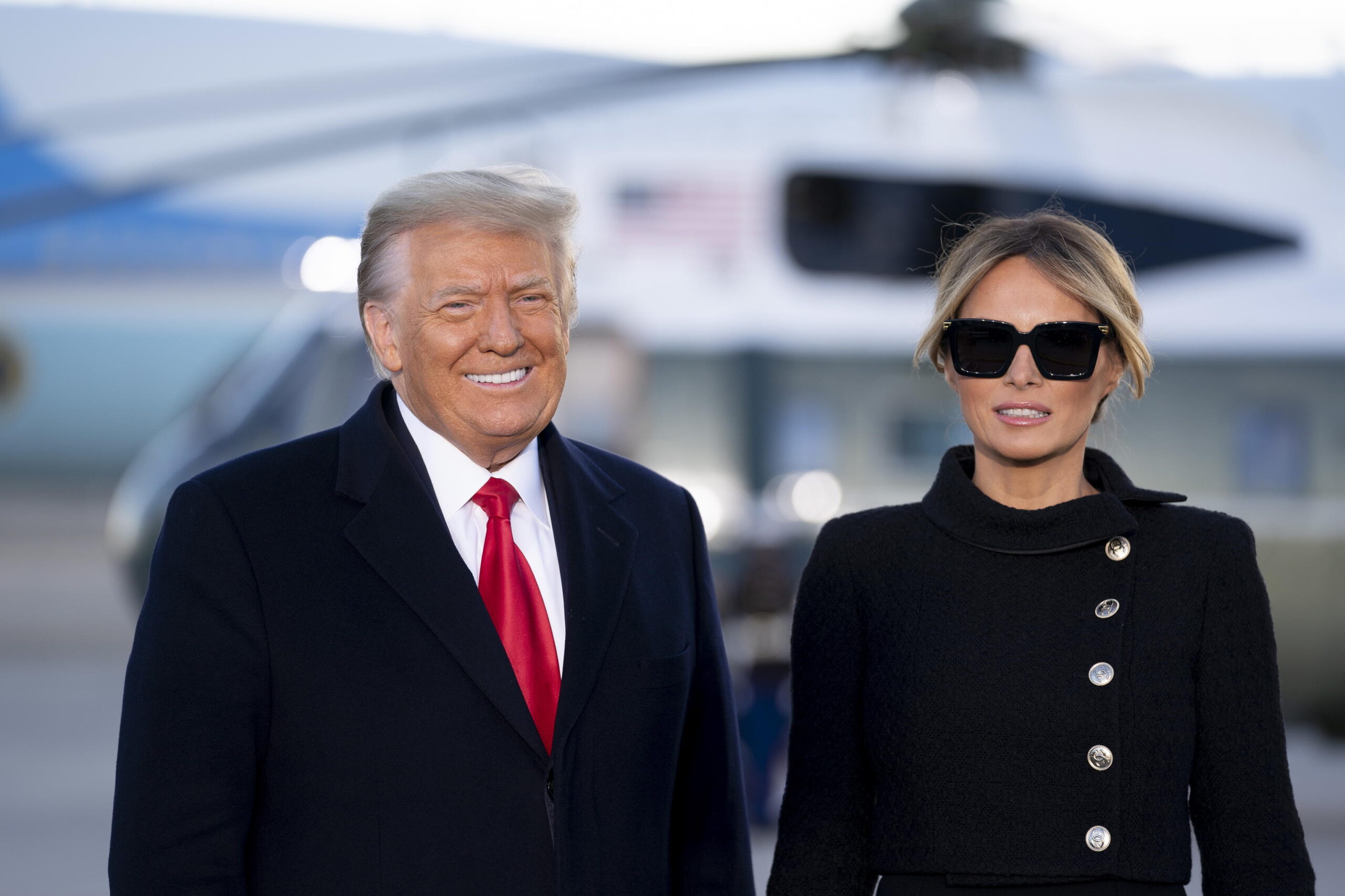 epa08951964 US President Donald Trump, left, and US First Lady Melania Trump arrive to a farewell ceremony at Joint Base Andrews, Maryland, USA, 20 January 2021. US President Donald J. Trump is not attending the Inaugration ceremony of President-elect Joe Biden. Biden won the 03 November 2020 election to become the 46th President of the United States of America.  EPA/Stefani Reynolds / POOL
