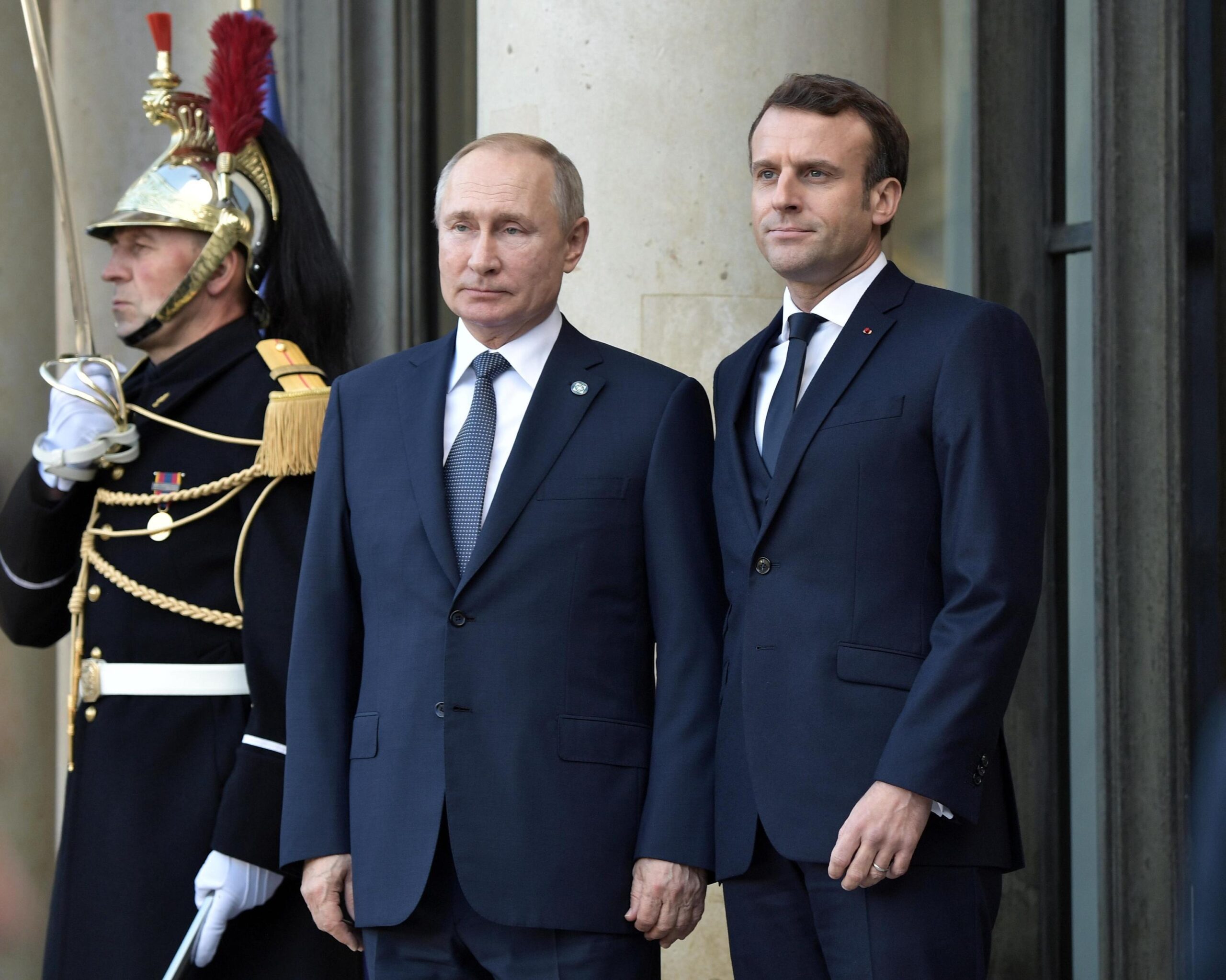 French President Emmanuel Macron (R) greets Russian President Vladimir Putin as he arrives to attend a summit on Ukraine at the Elysee Palace in Paris, France, 09 December 2019. ANSA/ALEXEI NIKOLSKY/SPUTNIK/KREMLIN POOL / POOL MANDATORY CREDIT/SPUTNIK