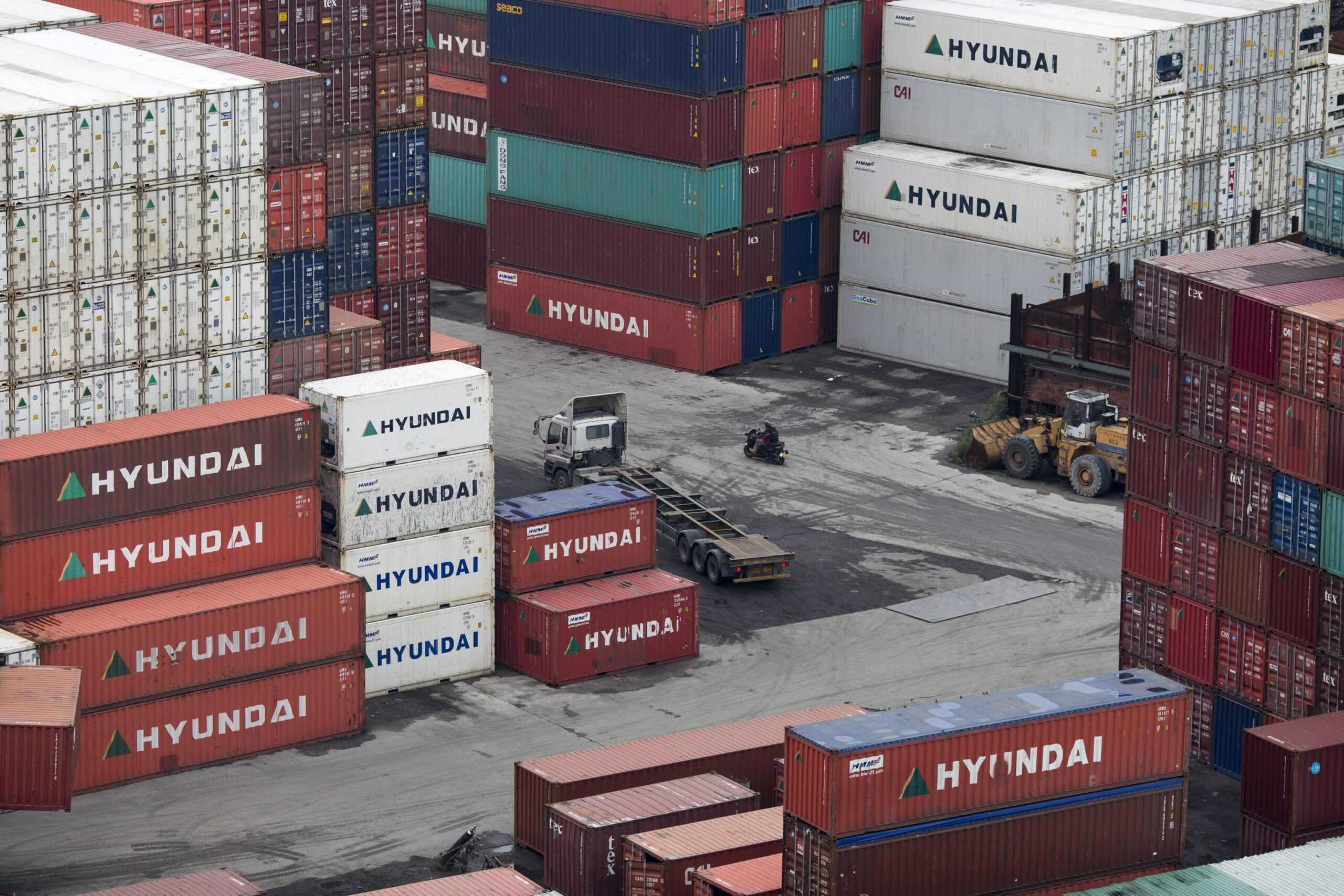 epa05167637 Shipping containers are stacked in Kwai Tsing container port in Hong Kong, China, 18 February 2016. The port ranked 4th in volume in 2014 but has now slipped to 5th place as port traffic has fallen over the past 18 months. Preference now seems to be given to the newer facilities in mainland China, such as Shenzhen and Shanghai ports, which can accommodate the draft requirement of new ultra-large container ships.  EPA/JEROME FAVRE