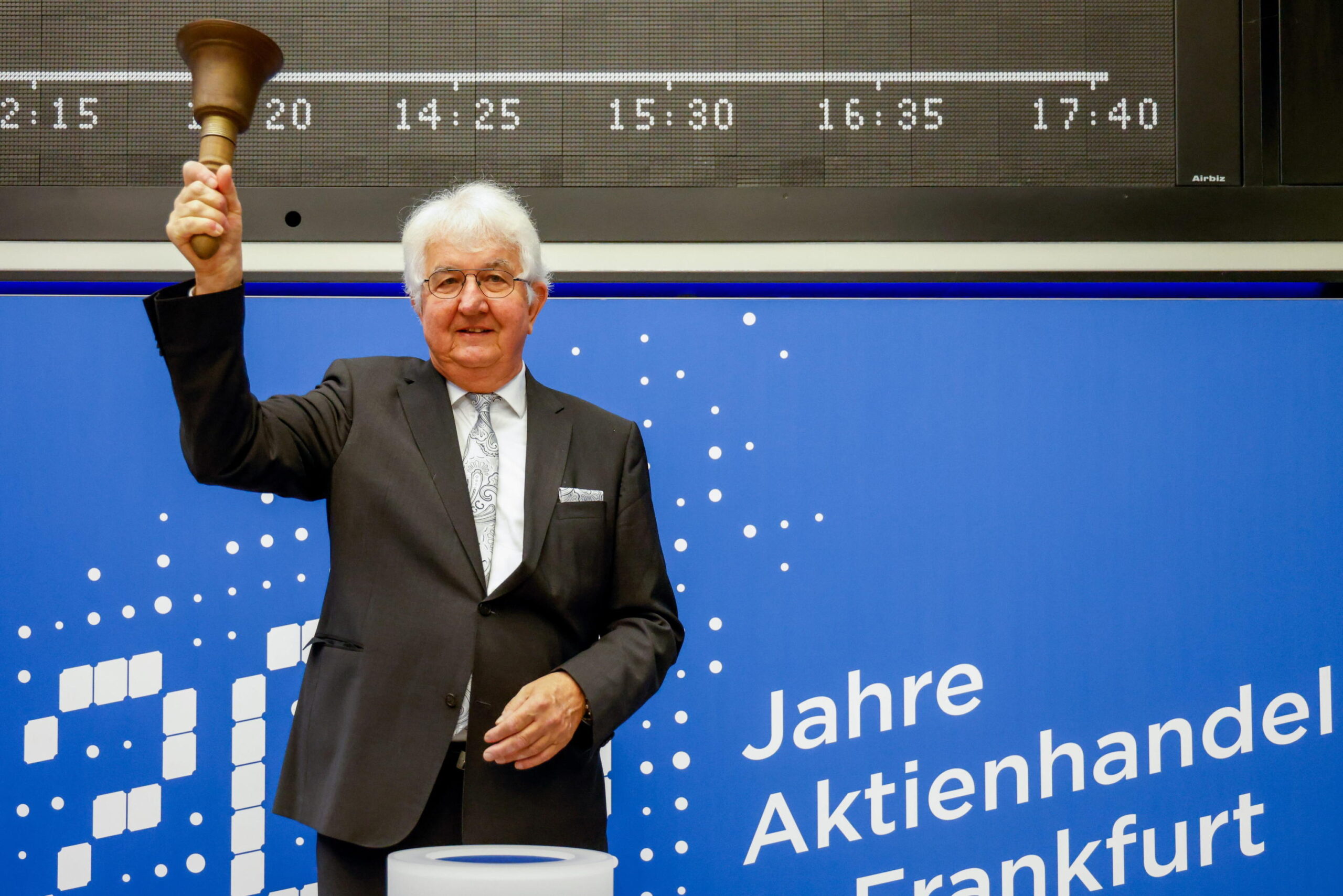 epa08656047 The Governor of the Austrian National Bank Robert Holzmann rings the Opening Bell on the trading floor at the Frankfurt Stock Exchange during the celebration of 200 years of stock trading in Frankfurt, Germany, 09 September 2020. The share of Austrian National Bank was first tradable share in Frankfurt in 1820.  EPA/JOERG HALISCH