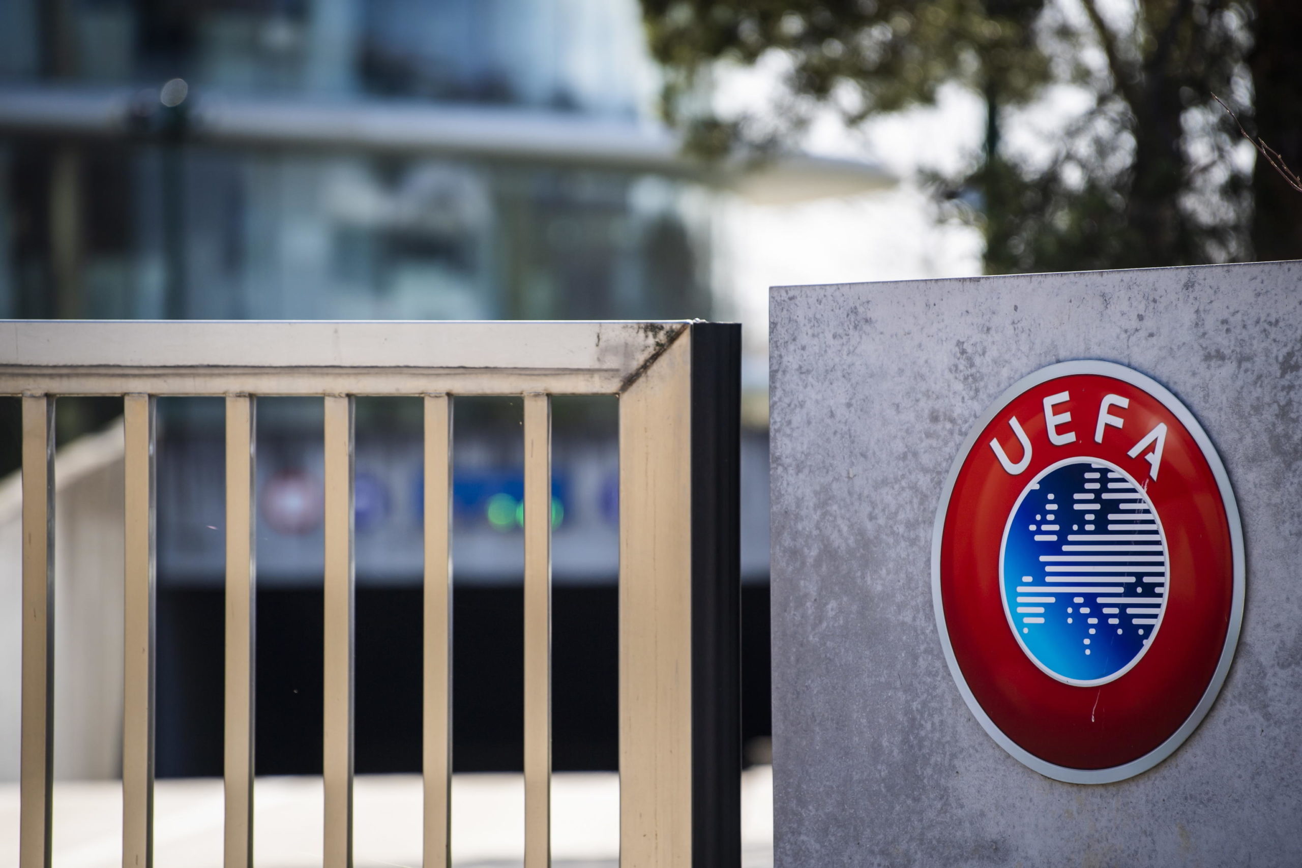 epa09792280 (FILE) - The UEFA logo is pictured at the entrance of the UEFA Headquarters, in Nyon, Switzerland, 17 March 2020 (re-issued on 28 February 2022). The European football governing body UEFA announced on 28 February 2022 to have ended its partnership with Gazprom across all competitions. 'The decision -announced UEFA- is effective immediately and covers all existing agreements including the UEFA Champions League, UEFA national team competitions and UEFA EURO 2024'.  EPA/JEAN-CHRISTOPHE BOTT *** Local Caption *** 55959937