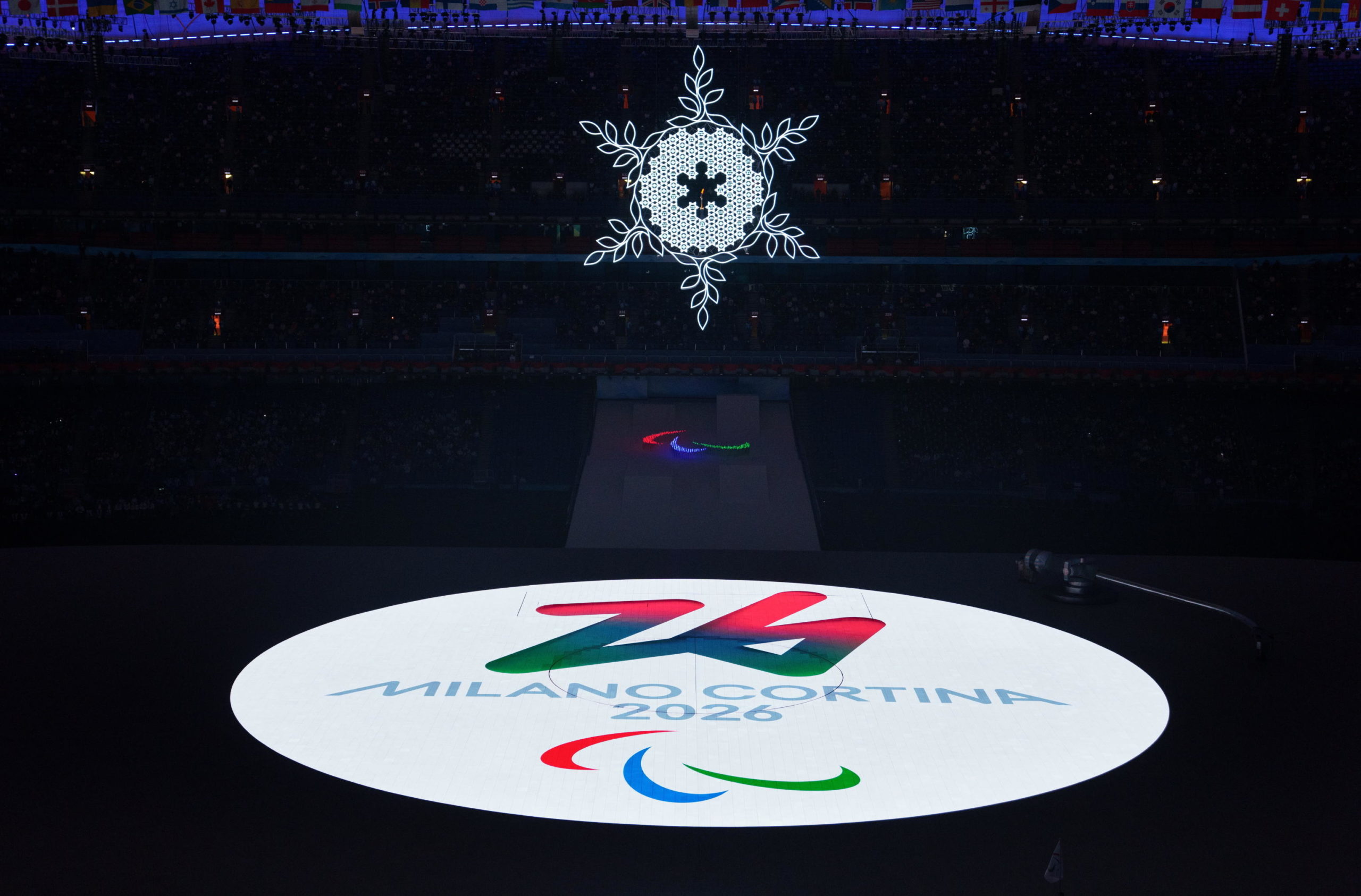 epa09821176 epa09821111 A handout photo made available by OIS/IOC shows Milano Cortina 2026 logo displayed on the stage following the Flag Handover Ceremony as part of the 2022 Winter Paralympic Games closing ceremony at the National Stadium in Beijing, China, 13 March 2022.  EPA/Bob Martin / HANDOUT  HANDOUT EDITORIAL USE ONLY/NO SALES HANDOUT EDITORIAL USE ONLY/NO SALES HANDOUT EDITORIAL USE ONLY/NO SALES HANDOUT EDITORIAL USE ONLY/NO SALES