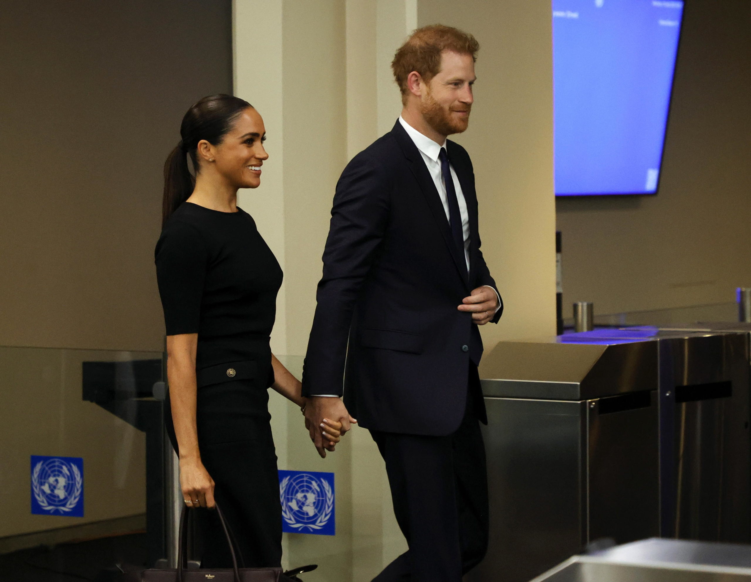 epa10077689 Britain's Prince Harry, Duke of Sussex (R) and his wife Megan, Duchess of Sussex arrive at the United Nations for the 2020 UN Nelson Mandela Prize at the United Nations (UN) headquarters in New York, New York, USA, 18 July 2022. Nelson Mandela International Day is observed on 18 July every year.  EPA/JASON SZENES