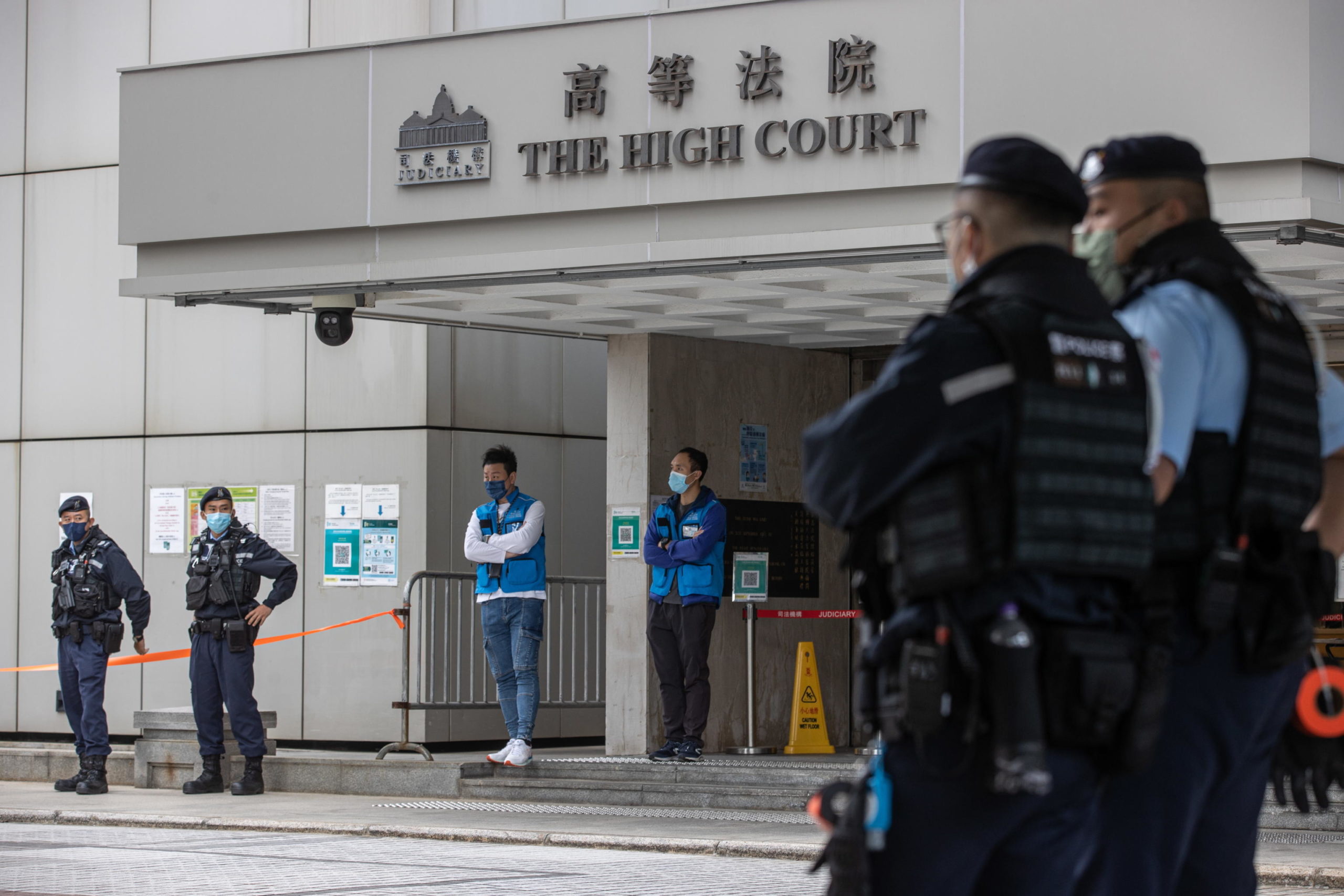 epa10340514 Police stand guard outside the High Court on the first day of the trial under national security law of media tycoon Jimmy Lai Chee-ying in Hong Kong, China, 01 December 2022. Lai is being tried under the national security law for conspiracy to print, publish, sell, offer for sale, distribute, display and/or reproduce seditious publications. Hong Kong Chief Executive John Lee Ka-chiu has asked the National People?s Congress (NPC) Standing Committee, Beijing?s top legislative body, to interpret the city?s national security law after the Court of Final Appeal upheld a decision allowing a British barrister to defend Lai. The trial has been adjourned to 13 December 2022.  EPA/JEROME FAVRE