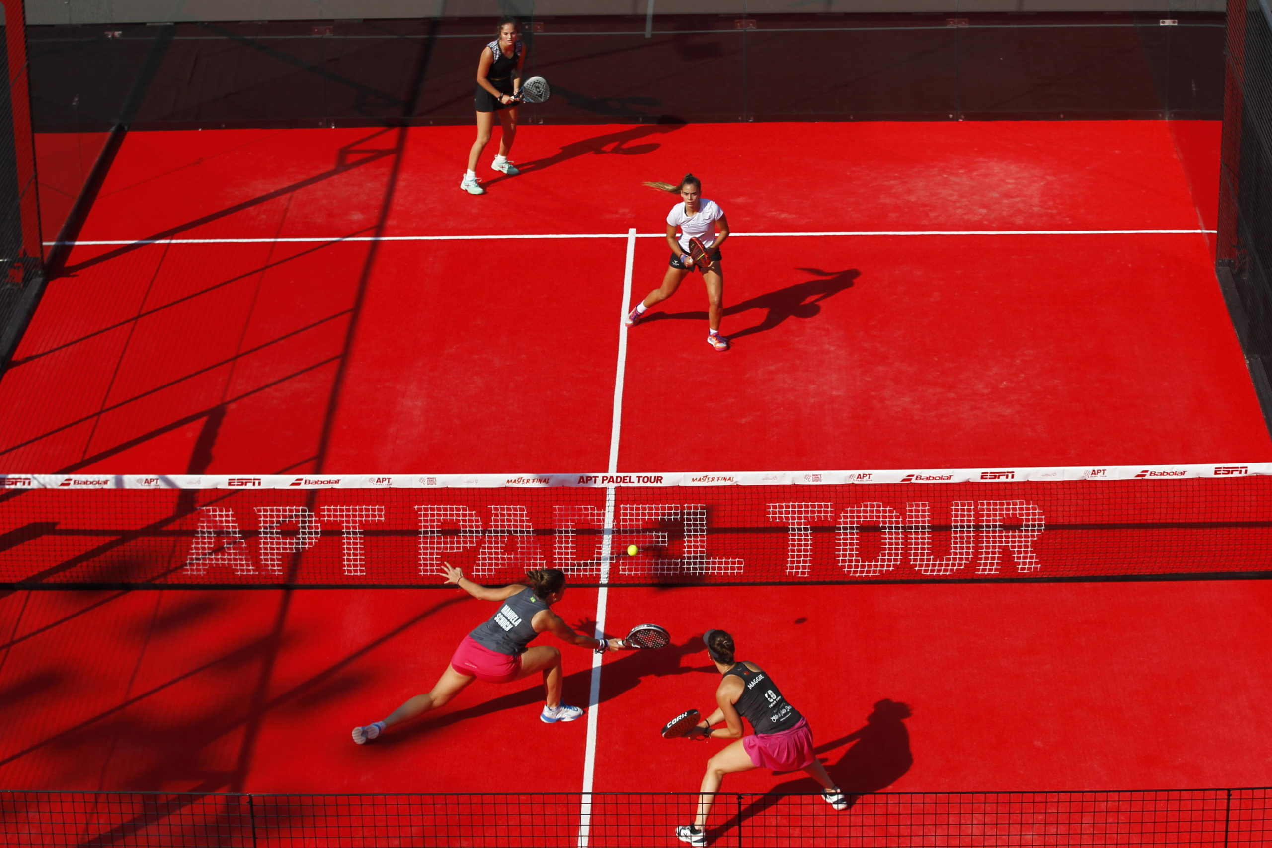 epa10358472 Spain's Marta Borrero (top L) and Patricia Martinez (top R) in action against Brazil's Manuela Schuck (bottom L) and Portugal's Margarida Fernandes (bottom R) during a doubles match for the APT Padel Tour Master Final tournament, in the Panamerican Tennis Center, in Guadalajara, Mexico, 09 December 2022.  EPA/Francisco Guasco