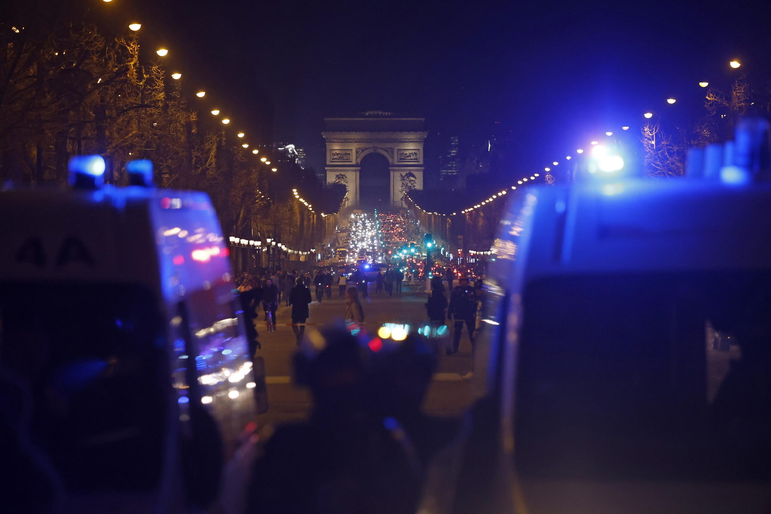 epa10527471 French police forces face protesters as clashes erupt on Place de la Concorde square, facing the French Parliament (National Assembly) in Paris, France, 16 March 2023, after French Prime Minister Elisabeth Borne announced the use of article 49 paragraph 3 (49.3) of the Constitution of France to have the text on the controversial pension reform law to be definitively adopted without a vote. EPA/YOAN VALAT